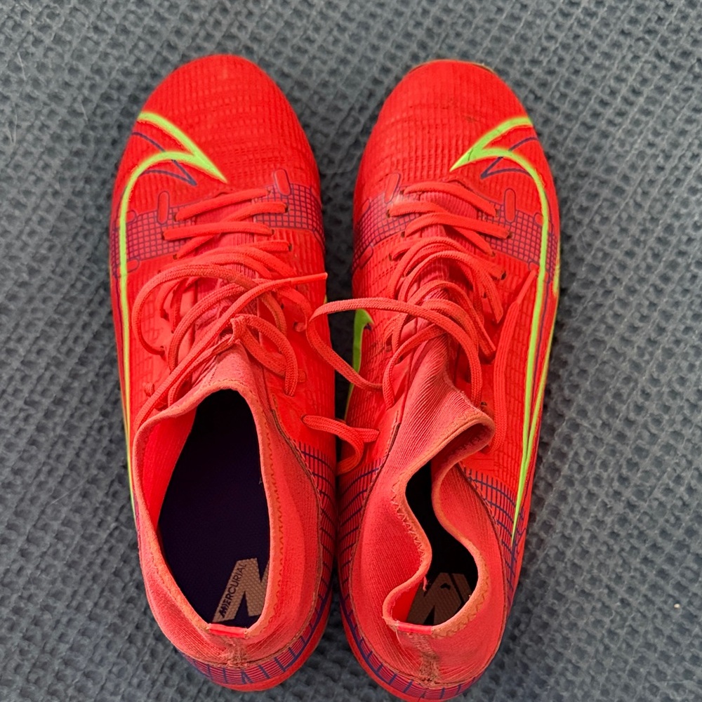 Red Nike mercurial cleats